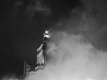 Low angle view of building against cloudy sky