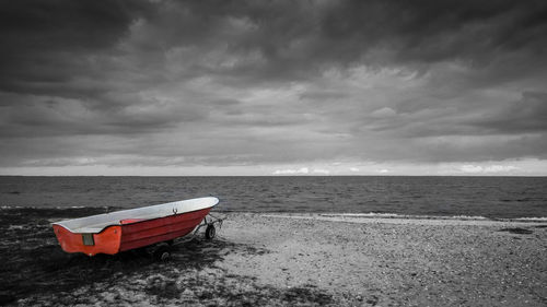 Scenic view of sea against cloudy sky