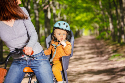 Portrait of smiling young woman riding bicycle