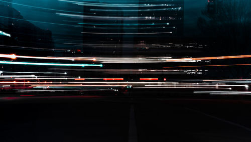 Light trails on road in city at night