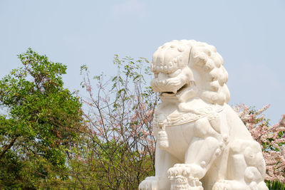 Low angle view of statue against sky