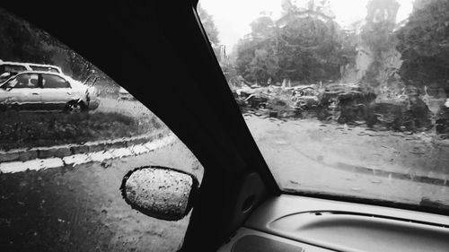 Cropped image of car on road