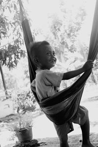 Rear view of boy looking away