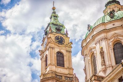 Low angle view of cathedral against cloudy sky