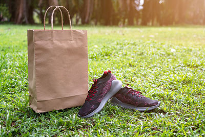 Close-up of shoes on field