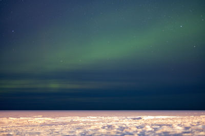 Scenic view of sea against sky at night