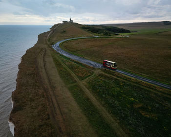 High angle view of road by sea against sky