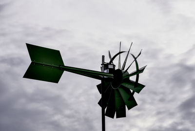 Low angle view of wind turbine against sky