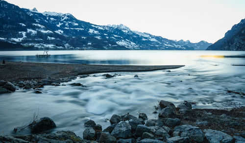 Scenic view of frozen lake against sky