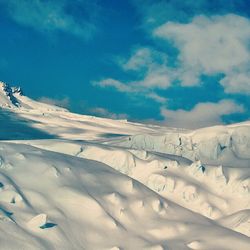 Scenic view of snow covered mountains