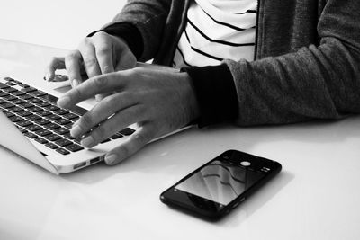 Close-up of hands on table