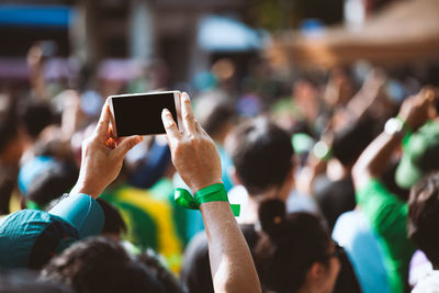 Group of people photographing through smart phone