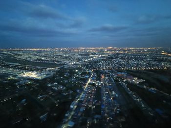 High angle view of illuminated buildings in city at night