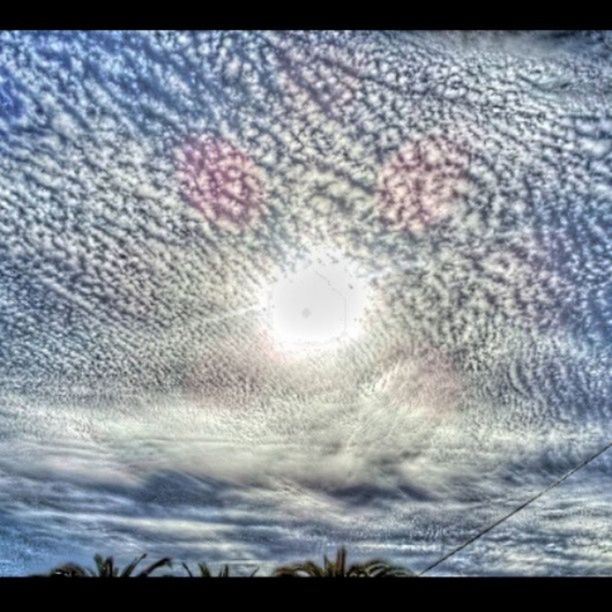 sky, cloud - sky, cloudy, scenics, beauty in nature, tranquility, nature, tranquil scene, cloud, weather, sunset, dusk, low angle view, dramatic sky, overcast, silhouette, outdoors, no people, idyllic, cloudscape