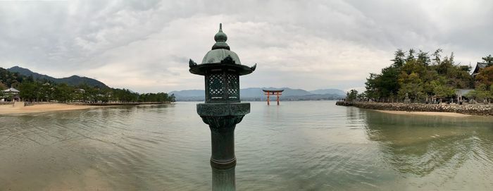 Scenic view of lake against sky, itsukushima shrine, japan