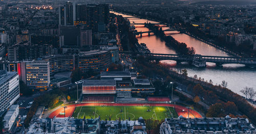 High angle view of illuminated bridge and buildings in city