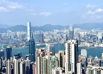 Aerial view of modern buildings in city against sky