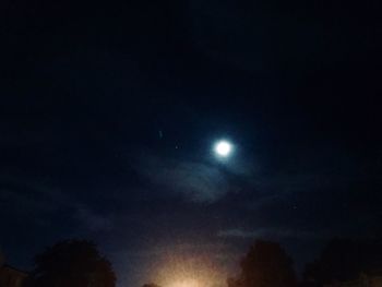 Low angle view of moon in sky at night