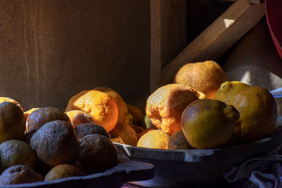 Fruits on bowl lighting by sun