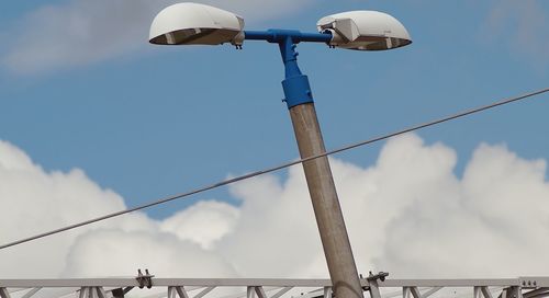 Low angle view of street light against sky