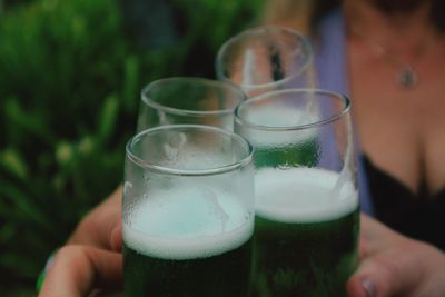 Close-up of friends toasting champagne flutes