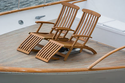 High angle view of wooden chairs in boat