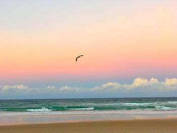 Scenic view of beach against sky during sunset