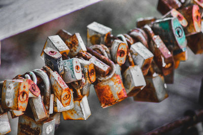 Close-up of padlocks hanging on metal