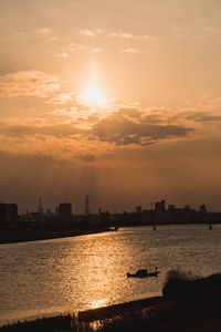 Silhouette of city at sunset