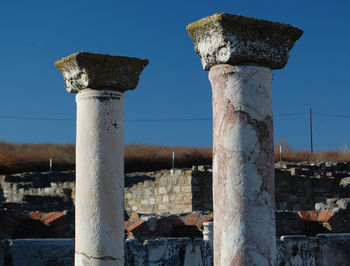 Close-up of old ruins against clear sky