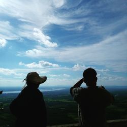 Silhouette of man against cloudy sky