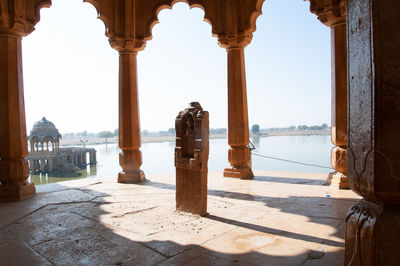 Panoramic view of colonnade and buildings against sky