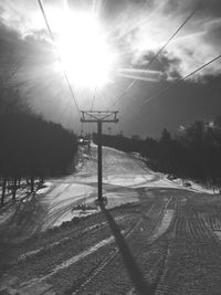 Ski lift over snow covered landscape