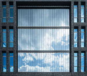 Reflection of clouds on modern building