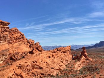 Man standing on mountain against sky