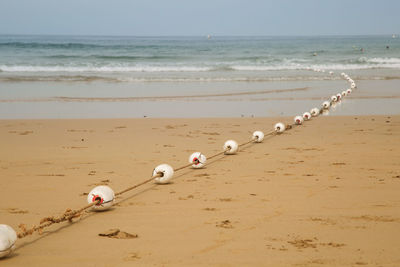 Buoys on a rope going into the ocean