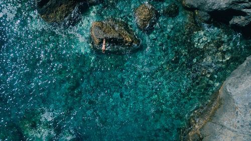 High angle view of man swimming in sea