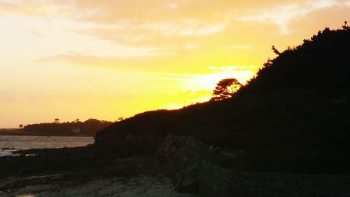 Scenic view of sea at sunset