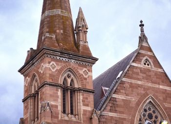 Low angle view of bell tower against sky