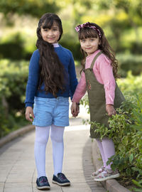 Full length portrait of a smiling girl