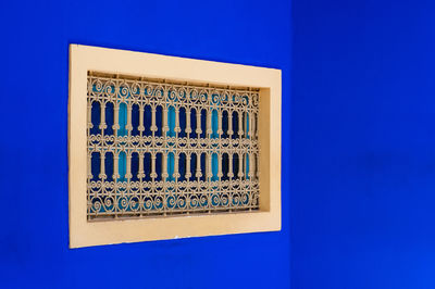 Window on blue wall