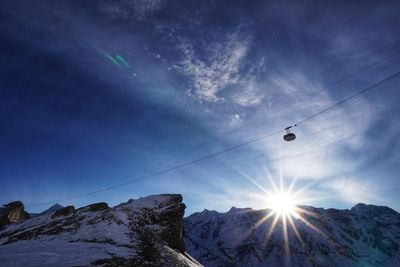 Low angle view of snowcapped mountains against sky - fying high