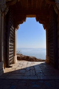 Mountains and clear sky seen through doorway of fort