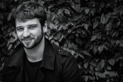 Portrait of smiling man standing outdoors