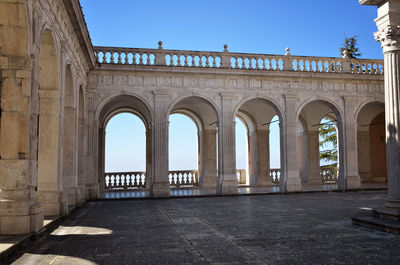 Colonnade of historic building against sky