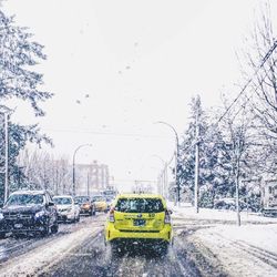 Cars on wet street in rainy season