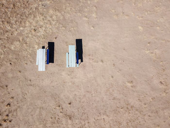 Directly above shot of picnic tables at beach