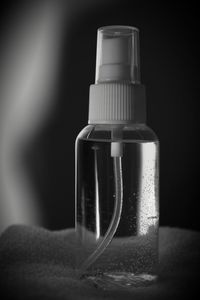 Close-up of wineglass against black background