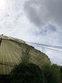 Low angle view of cables against sky