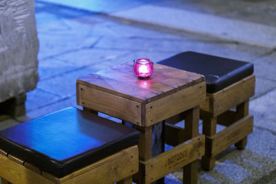 Close-up of illuminated lighting equipment on table